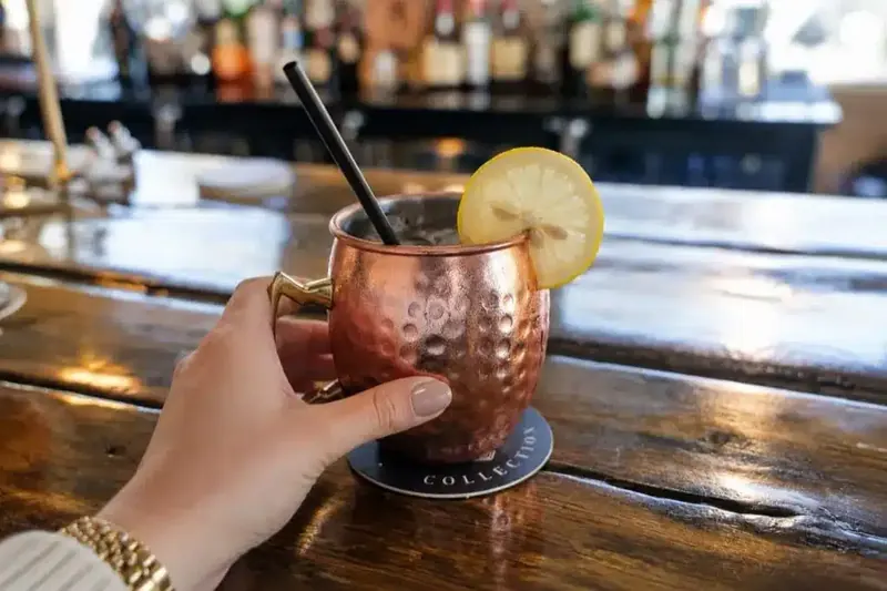 A copper mug cocktail on the bar
