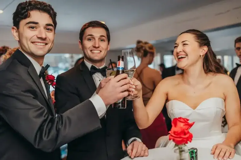 Guests raising glasses in a toast